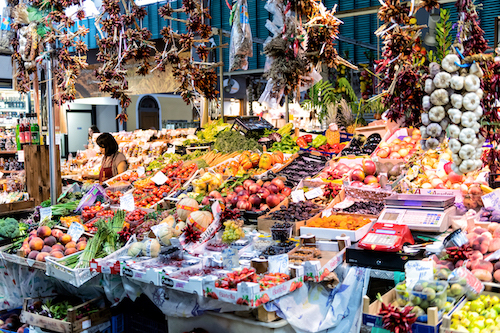 admiring a market in italy while living with The Good Life Abroad